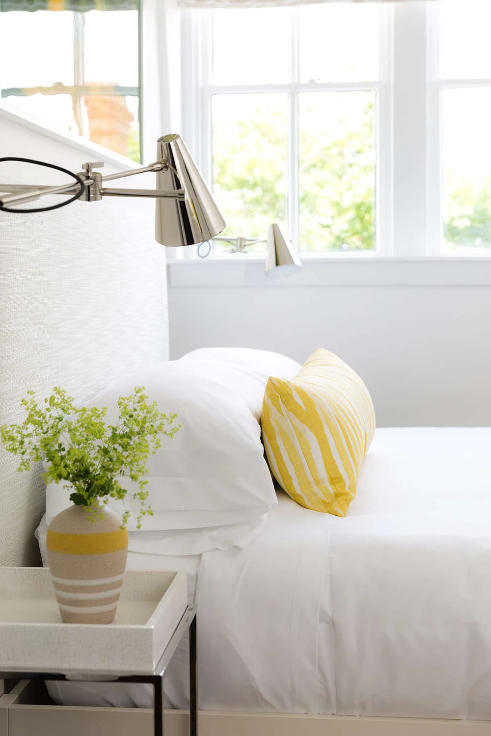Close up of a queen bed in a 21 Broad Hotel guestroom