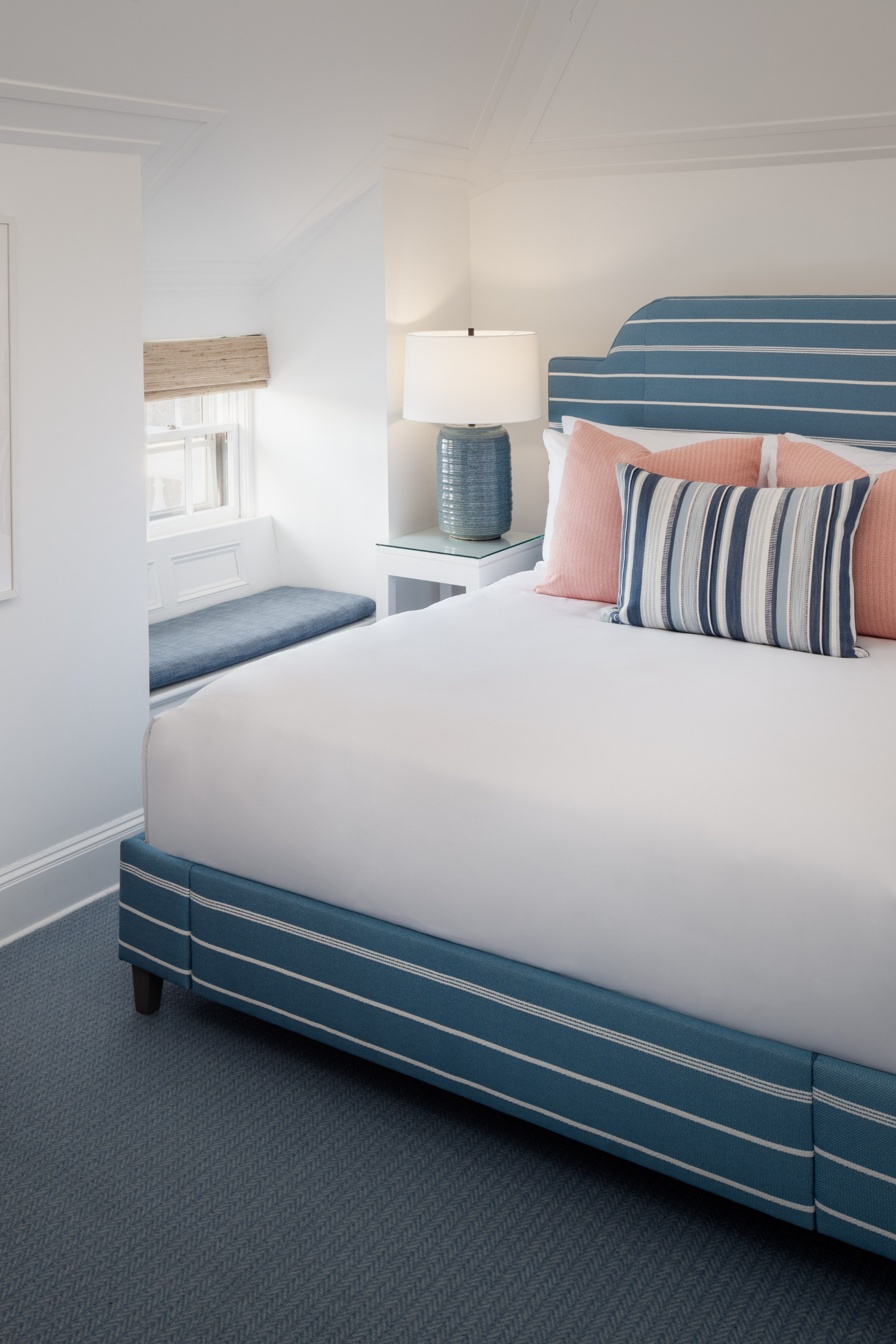 Queen Deluxe guest room with a window seat at 76 Main Ink Press Hotel