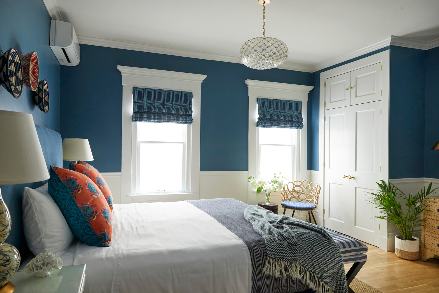 Guest room with lots of natural light and a comfy seating area at The Christopher