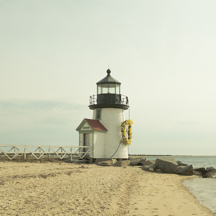 Brant Point Lighthouse in Nantucket with a daffodil wreath on it