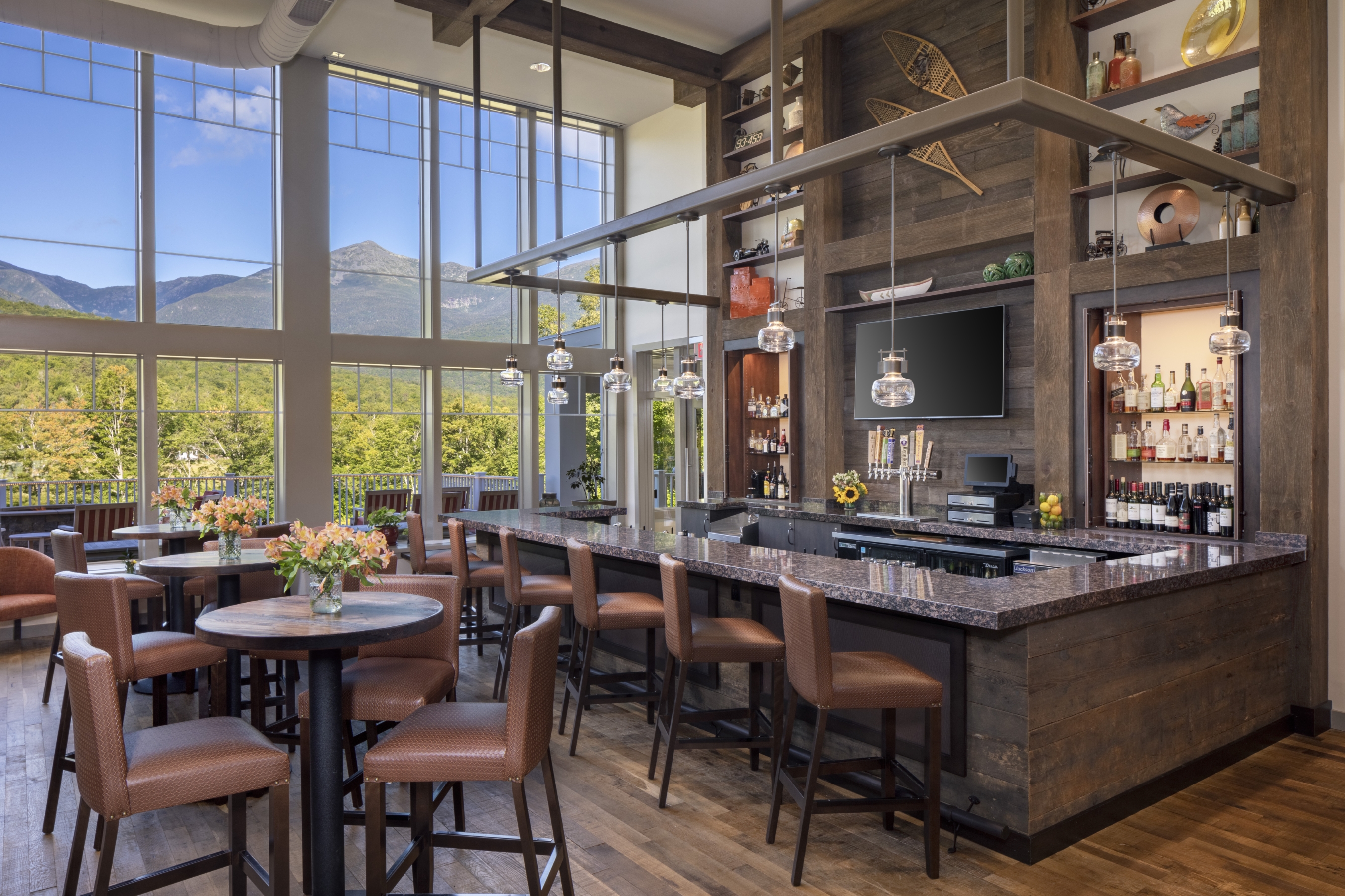 The Notch Grille bar with a scenic mountain view in the summer