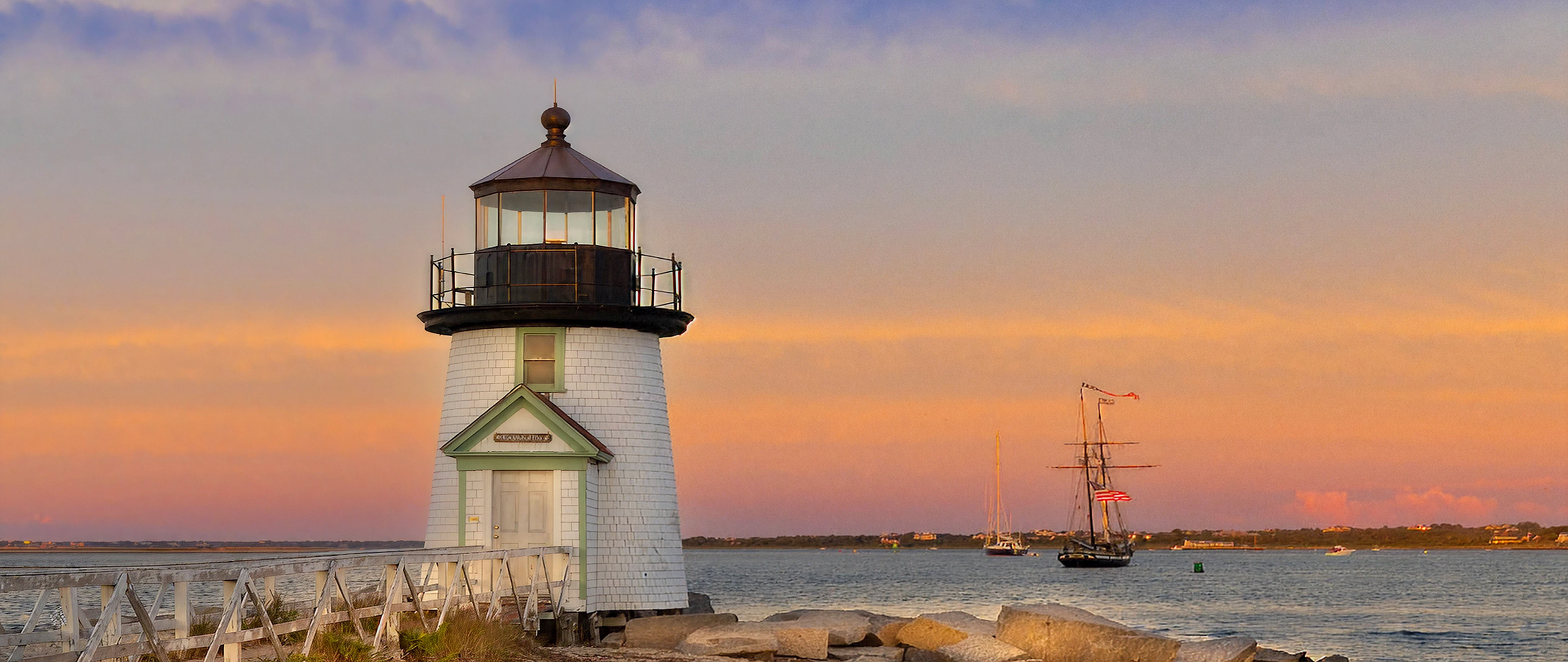 Lighthouse with a pink sunset in the background