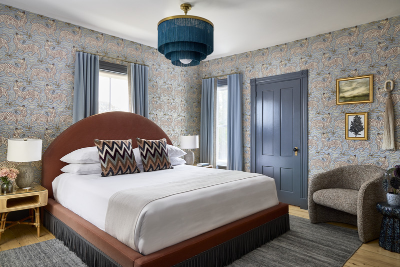 The Tribal King room at The Coco featuring an animal pattern wallpaper