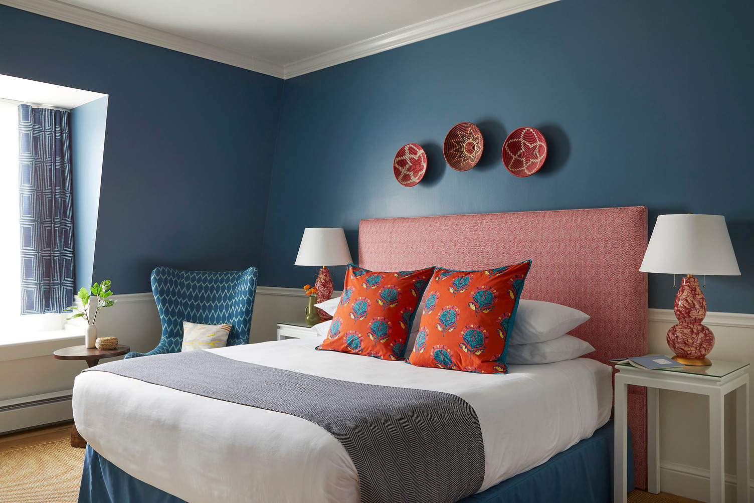 Queen guest room with a comfortable seating area at The Christopher