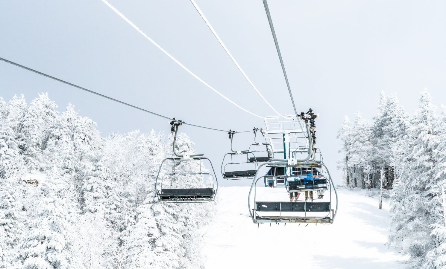 Gondolas bringing skiers up the mountain