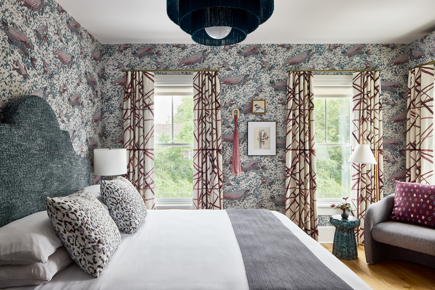The Coastal Nook King guest room featuring fish patterned wallpaper