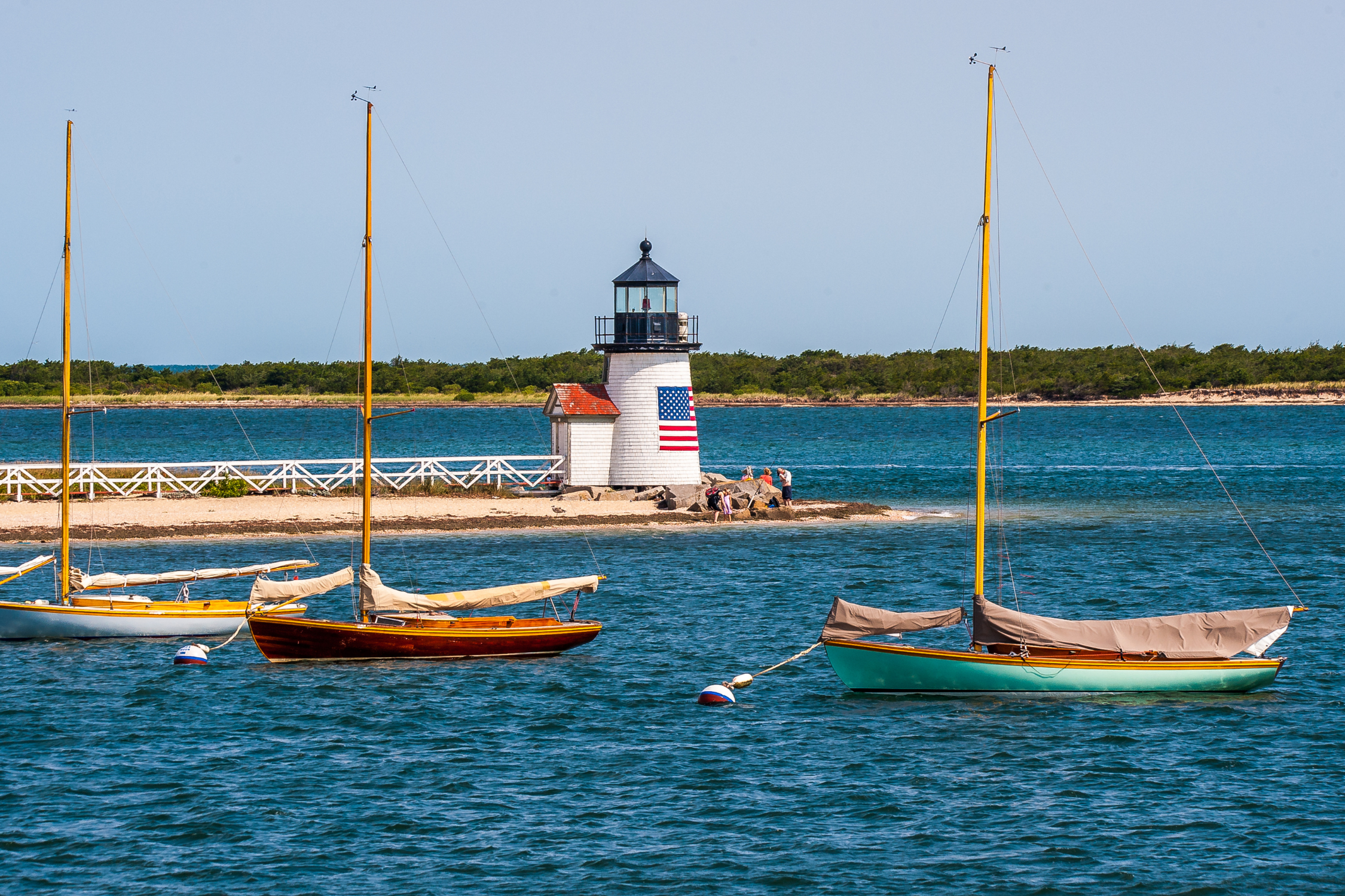 Brand Point Lighthouse with an American Flag on the front of it